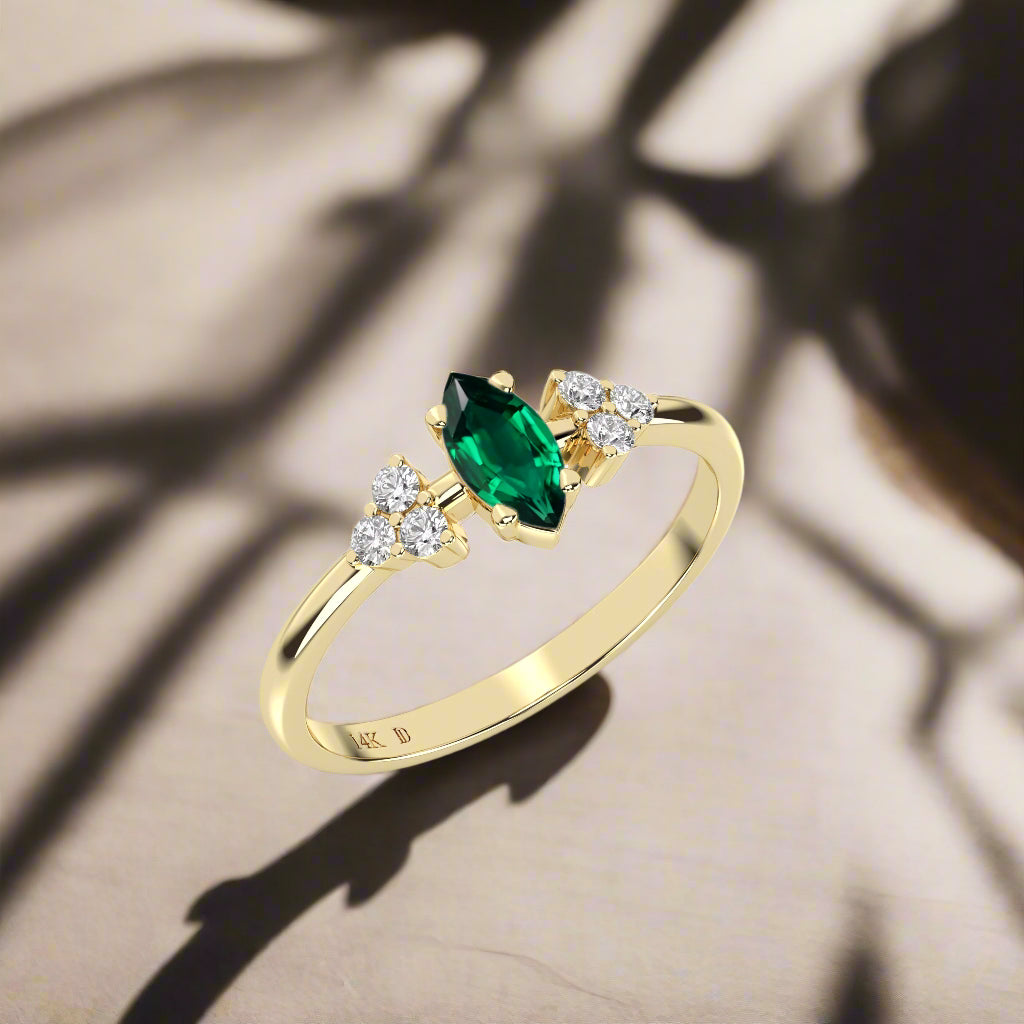 EMERALD MARQUISE CLUSTER RING IN GOLD