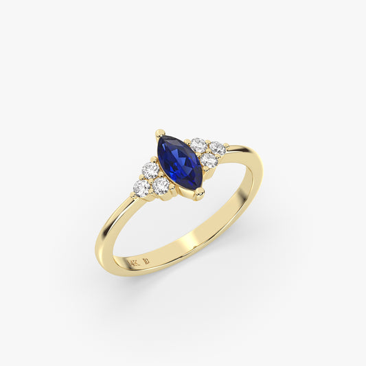 SAPPHIRE MARQUISE RING WITH ROUND DIAMONDS IN GOLD